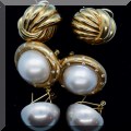 J07. Gold earrings. (Middle pair with diamonds.) 